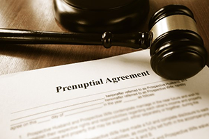 Gavel and prenuptial agreement on desk
