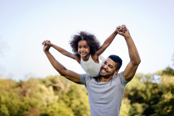 Father holding his daughter up in the air